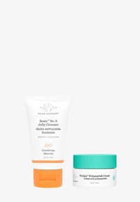 Drunk Elephant Beste No. 9 Jelly Cleanser: white tube with orange accents, 30 ml. Protini Polypeptide Cream: white jar with a teal lid, 15 ml.