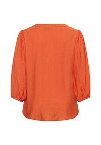 Blouse orange à manches longues avec manches bouffantes et poignets froncés, vue de dos, présentant un col droit et un tissu lisse.