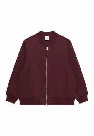 Vinrød bomberjakke med glidelås foran, ribbet krage, mansjetter, kant og to skråstilte frontlommer.