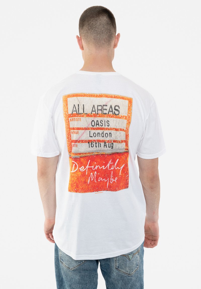 White cotton t-shirt displaying a colorful concert ticket graphic on the back, featuring orange accents and the text "Definitely Maybe."