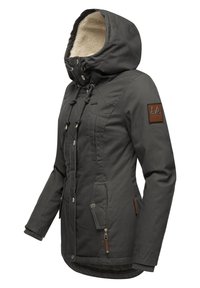 Grey winter jacket with a fur-lined hood, zippered and snap-button front, multiple pockets, and a leather logo patch on the arm.
