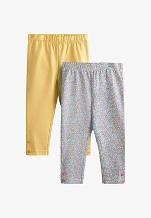 To par børns leggings, den ene ensfarvet gul med knapper ved manchetterne, den anden med flerfarvet blomsterprint og lyserøde knapper ved manchetterne.