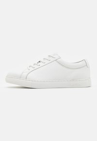 White sneaker with smooth leather upper, rounded toe, tonal stitching, flat laces, and a textured rubber sole. Subtle branding on heel.