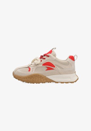 Beige and red low-top sneaker with textured brown sole, red lace details, pull tabs on heel and tongue, and white midsole pattern.