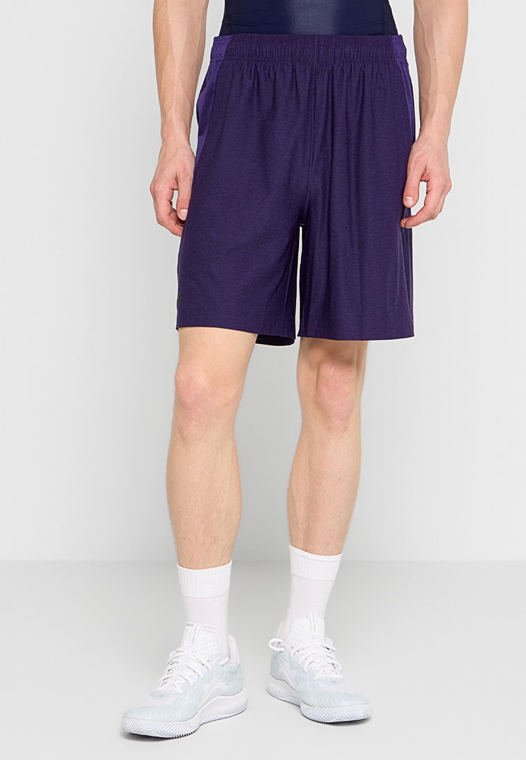 Pantaloni sportivi viola con cintura elastica, realizzati in un tessuto liscio. Presentano tasche laterali e una vestibilità comoda e rilassata.