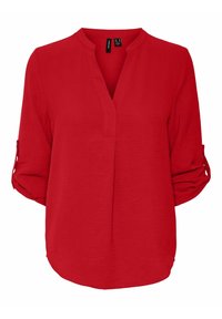 Blusa rossa con colletto alla mandarino, maniche arrotolate a tre quarti e orlo dritto. Realizzata in tessuto leggero con una finitura testurizzata.