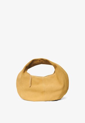 Suede hobo bag in mustard yellow. Soft texture, curved silhouette, and a wide strap. Features a zip closure and minimal seams.