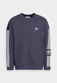 Tummansininen huppari, jossa on pitkät hihat. Sisältää valkoiset kolmonauhakuviot hihoissa ja pienen valkoisen adidas-logon rinnassa.