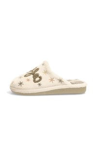 Zapatilla de color crema hecha de un material suave y aterciopelado. Presenta estrellas bordadas y un diseño decorativo. Plantilla acolchada y suela plana.