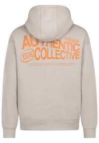 Beige hoodie featuring a large orange graphic text design on the back, with the words "AUTHENTIC YOUNG COLLECTIVE" and additional text below.