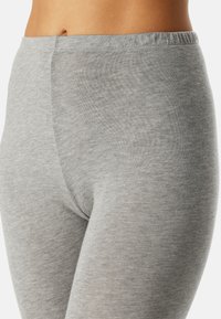 Grijze katoenen leggings met een soepele textuur, rekbare tailleband en een aansluitend ontwerp, op middenhoogte geknipt voor extra comfort.