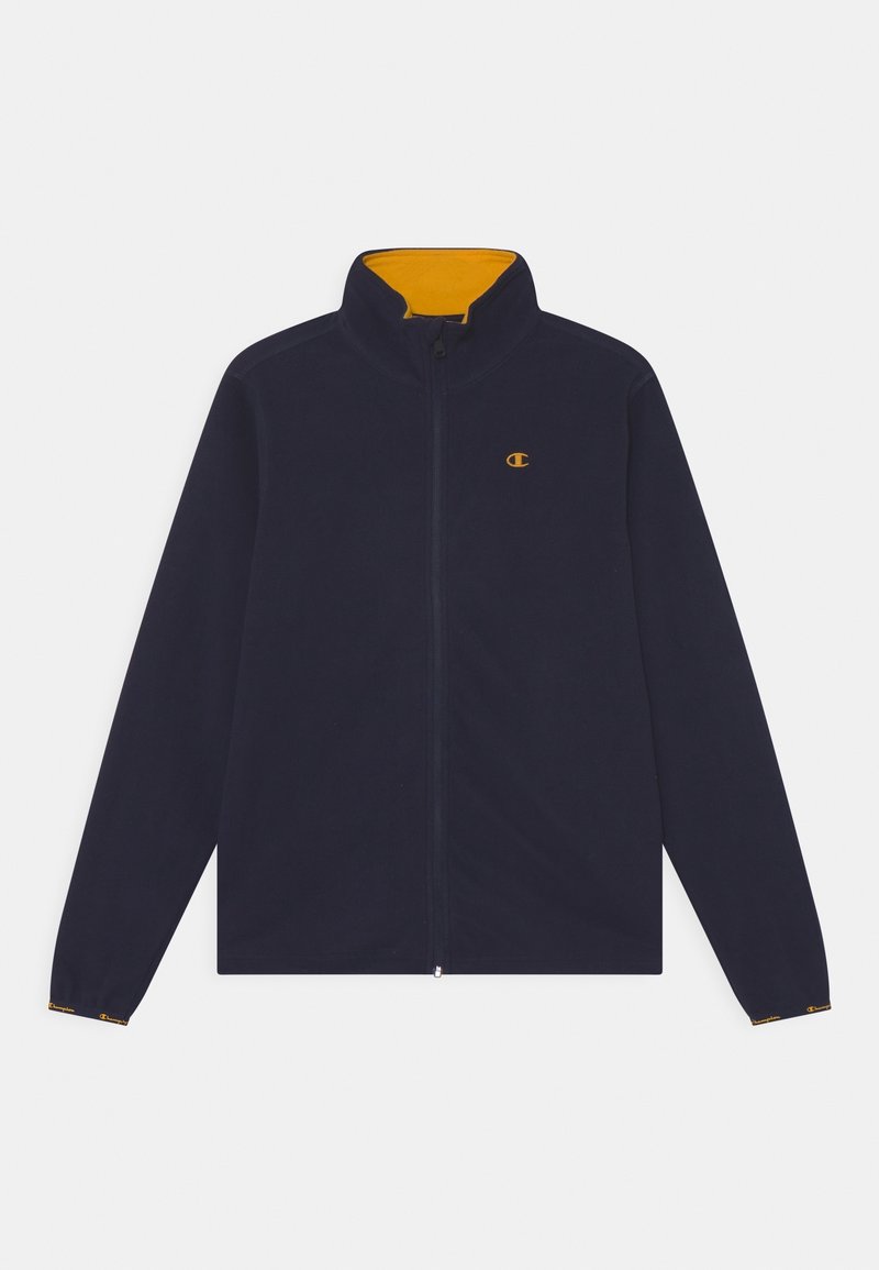 Giacca in pile blu navy con collo alto, interno contrastante giallo, cerniera frontale completa e polsini elastici con accento logo sulle maniche.