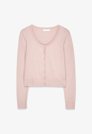 Svetloružový, skrátený kardigán vyrobený z mäkkej pleteniny. Má okrúhly výstrih, dlhé rukávy a radu guľatých gombíkov na prednej strane.
