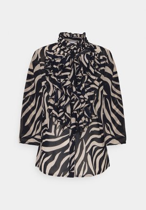 Zwart-beige doorschijnende blouse met gedurfde zebraprint, voorzien van een geruffelde voorkant, hoge halslijn en knoopsluiting.