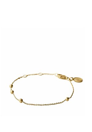 Delicada pulsera de cadena de oro con cuatro pequeñas cuentas redondas espaciadas uniformemente y un cierre de langosta con un pequeño colgante redondo.