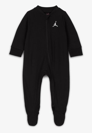 Body noir bébé à manches longues avec pieds, fermeture éclair à l'avant, et petit logo Jumpman blanc sur le côté gauche de la poitrine.