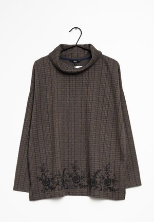 Brun og marineblå ternet langærmet rullekravepullover med sort blomsterbroderi langs den nederste kant, hængende på en sort bøjle.