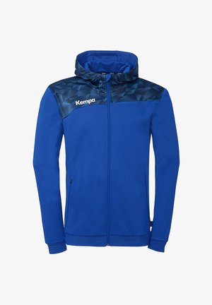 Sweat à capuche bleu à fermeture éclair complète avec motif géométrique foncé sur les épaules, poignets élastiques, poches latérales zippées et logo "Kempa" sur la poitrine.