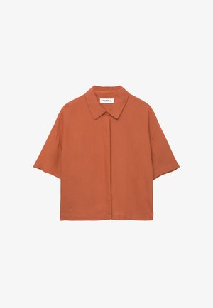 Chemise à manches courtes couleur rouille avec un col et une fermeture à boutons sur le devant. Fabriquée en tissu doux et léger.