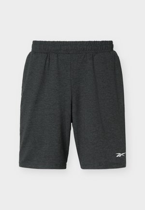 Pantalones cortos deportivos de color gris oscuro con cintura elástica y bolsillos laterales, con un pequeño logo blanco de Reebok en la pierna izquierda.