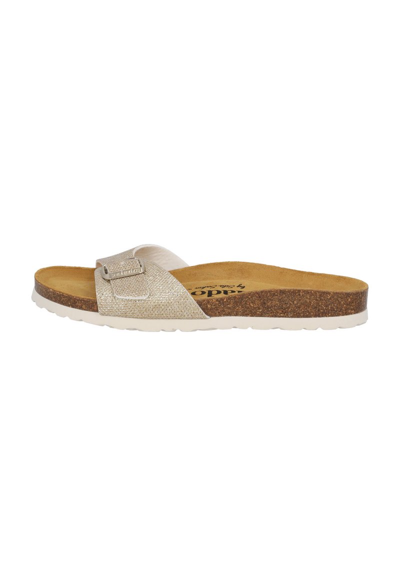 Light beige slip-on sandal with textured upper, adjustable strap with silver buckle, cork footbed, and white rubber sole.