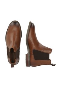 Ruske nahkasaapaat nilkkapitkällä, joustavilla sivupaneeleilla, pyöreällä varpaalla ja hienovaraisella ommelkoristuksella. Littealla kumipohjalla ja vetokilvellä helppoa pukemista varten.