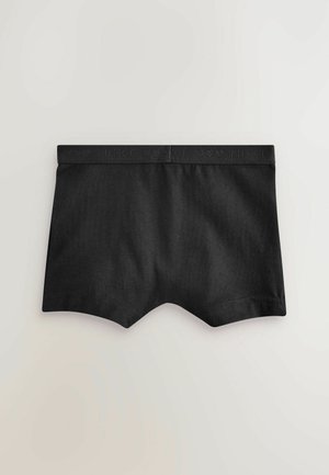 Svarta bomullsboxershorts med en slät yta, med en kontrasterande svart elastisk midjeresår präglad med "NEXT."