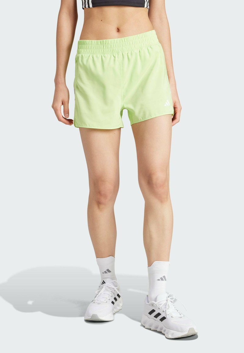 Light green athletic shorts with an elastic waistband, featuring a smooth texture and a small white logo on the left lower side.