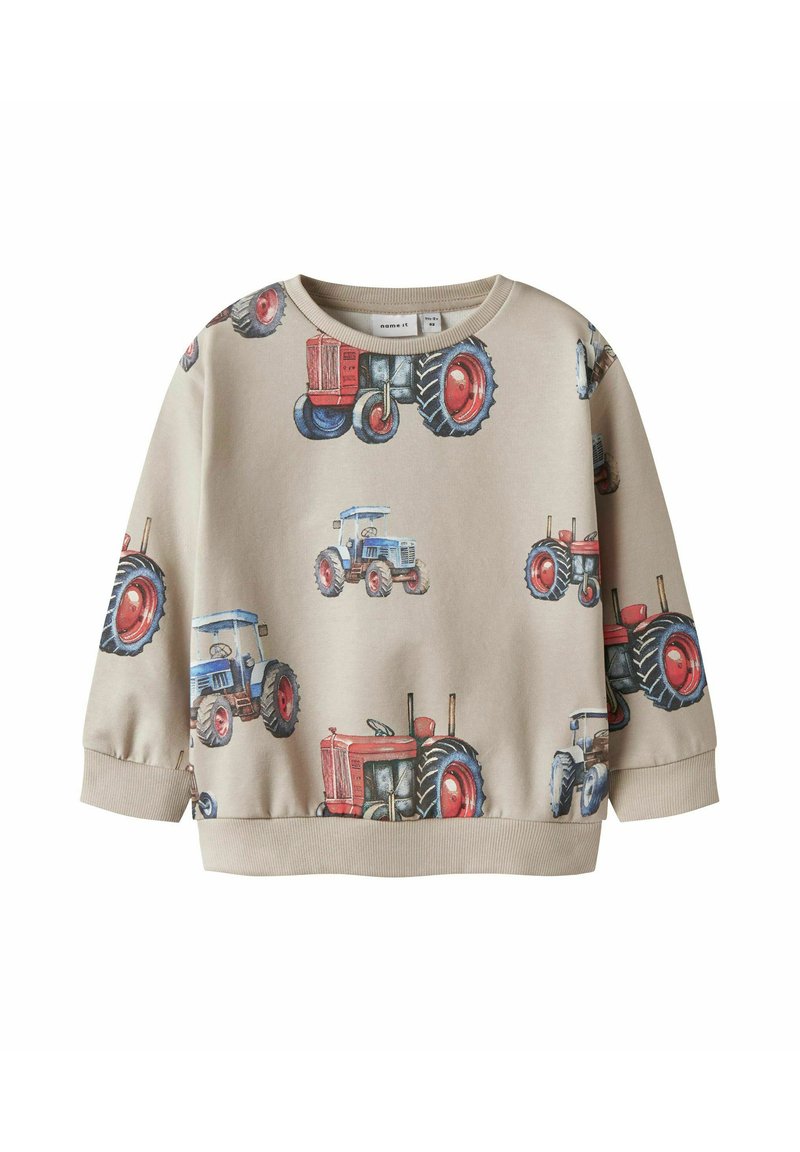 Felpa beige con stampa di un trattore in rosso e blu, colletto rotondo, maniche lunghe e polsini a coste. Materiale in cotone morbido.