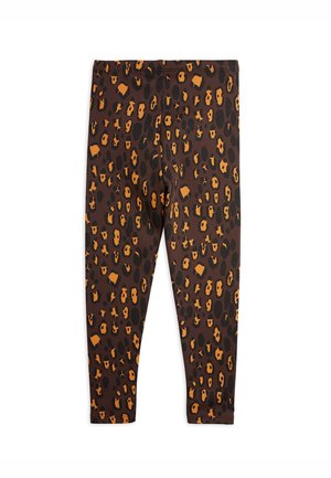 Leggings marrones con un patrón de estampado de leopardo en naranja y negro, que cuentan con una textura suave y una cinturilla elástica.