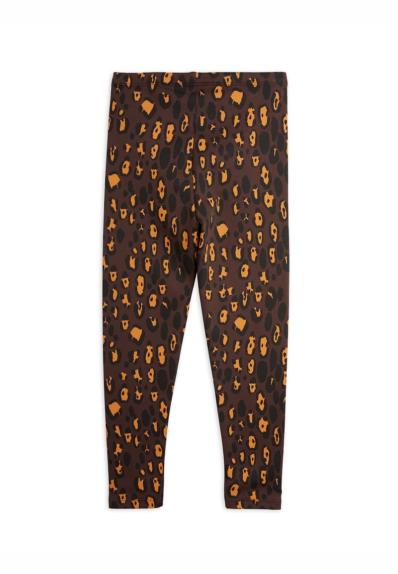 Des leggings bruns avec un motif léopard noir et orange, dotés d'une texture lisse et d'une taille élastique.