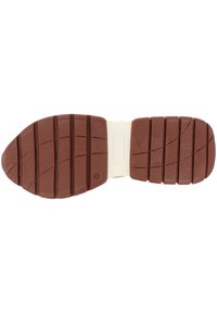 Semelle de bottes en caoutchouc marron avec de larges rainures et une section médiane blanche, vue par le dessous.