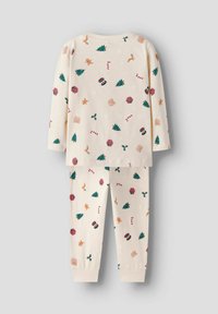 Zestaw piżam dla dzieci w kolorze kremowym z świątecznymi wzorami drzew, cukrowych lasek i pierników. Wykonany z miękkiej bawełny, z długimi rękawami i elastycznymi mankietami.