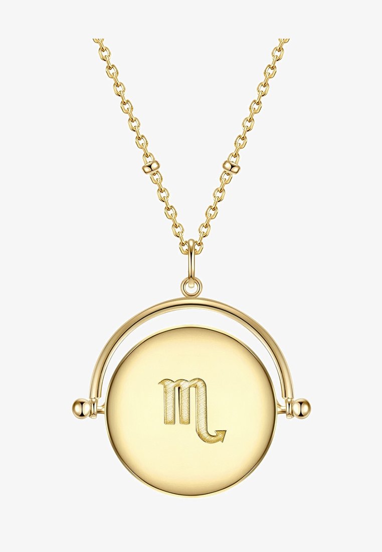 Zelta piekabei, kas izgatavota no apļa diska ar gravētu Skorpiona simbolu. Kaklarotas ķēdīte ir ar teksturētām saitēm un dekoratīvām detaļām netālu no aizdare.