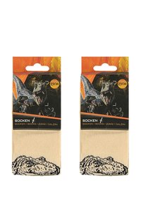 Beige Socken mit einem schwarzen Dinosaurier-Motiv an der Spitze, verpackt mit einer orange-schwarzen Karte, die die Größe zeigt.