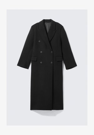 Mustast villasegust materjalist kaheksaklahviline mantel, millel on sälguga krae, pikad varrukad, kaks esist taskut ja sile pind.