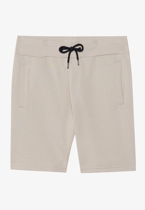 Pantaloni corti beige realizzati in tessuto morbido, dotati di una fascia elastica in vita con un laccio nero e due tasche laterali. Design semplice e taglio dritto.