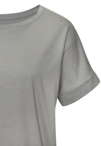 Grey cotton t-shirt with a crew neckline and rolled short sleeves. The fabric has a smooth texture, featuring minimal stitching details.