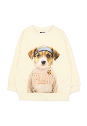 Crèmekleurige trui met een afbeelding van een puppy met een hoofdband en een sweatshirt met het opschrift PLAY en een gele smiley-badge.