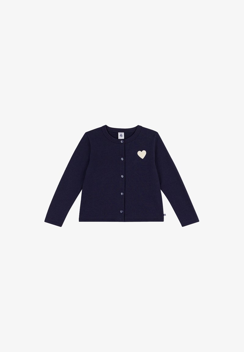 Cardigan bleu marine à manches longues avec boutons sur le devant et un petit emblème en forme de cœur blanc sur le côté supérieur gauche.