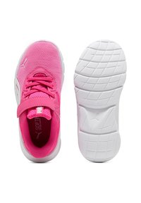 Pink athletic shoes with a mesh upper, white rubber sole, adjustable strap, and textured tread for traction. Notable brand logo on side.