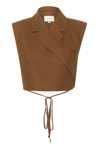 Top avana a manica corta con colletto, caratterizzato da una tasca frontale e chiusura a cravatta in vita, realizzato in un tessuto testurizzato.