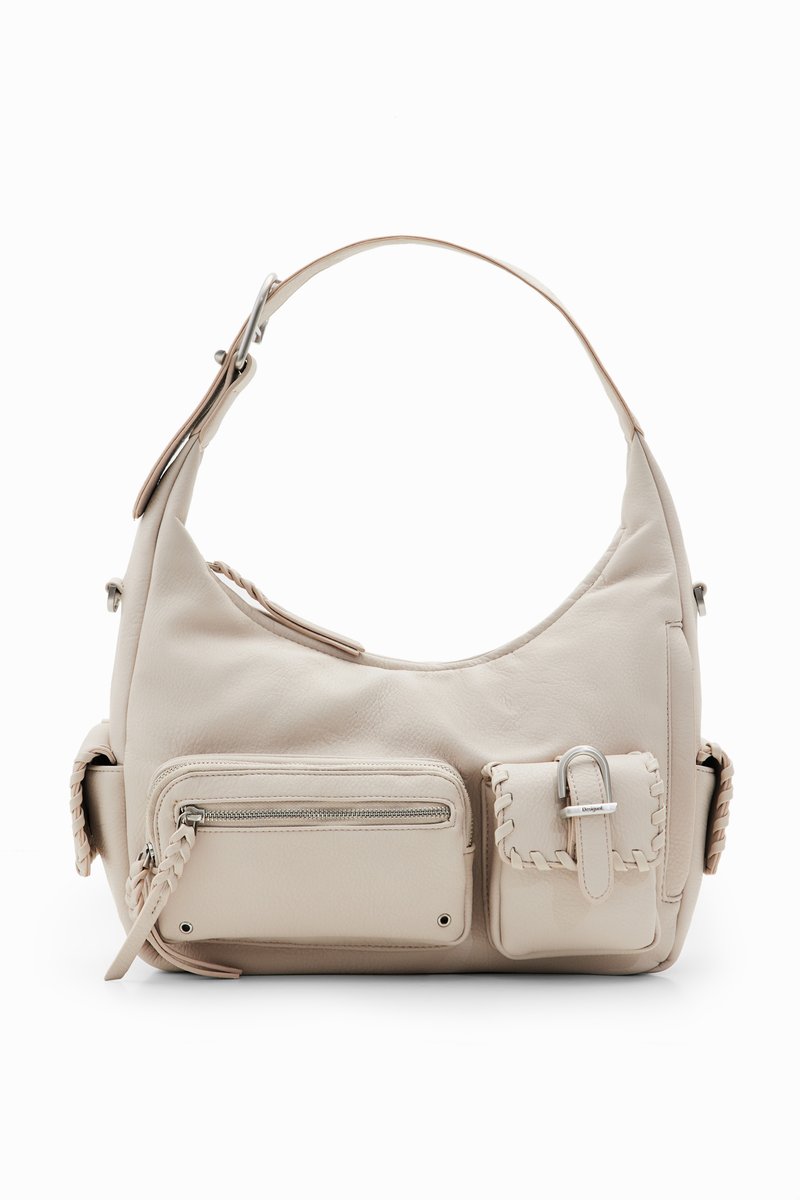 Sac à épaule en cuir beige avec une forme incurvée, doté d'un compartiment principal zippé, d'une poche zippée sur le côté et d'accents décoratifs en tresse.