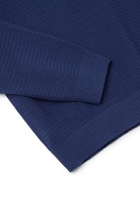 Navy blue textured sweater with ribbed cuffs and hem. Features a diagonal knit pattern on the body. Soft fabric with a smooth finish.