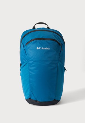 Μπλε σακίδιο πλάτης Columbia με μαύρες λεπτομέρειες φερμουάρ και κορυφαία λαβή, εμφανιζόμενο σε απλό λευκό φόντο.