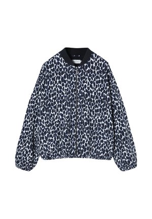 Veste zippée à manches longues avec un motif à taches irrégulières noir et blanc et un col et des poignets côtelés noirs.