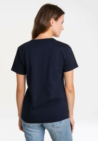 Navy blue short-sleeve t-shirt with a crew neckline, made of cotton, featuring a smooth texture and a fitted cut. No visible graphics.