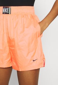Nike Sportswear Treningo apatinė dalis - atomic orange/black