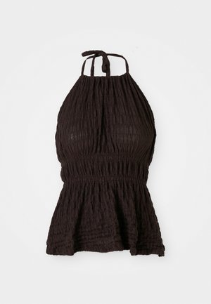 Black halter top with textured fabric, smocked waistband, and adjustable tie straps. Features a peplum design for added shape.