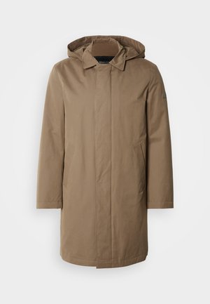 Lange, gewatteerde jas in een gedempte bruine kleur. Gemaakt van gladde stof met zijzakken en een recht gesneden ontwerp. Minimalistische stijl, zonder zichtbare patronen.